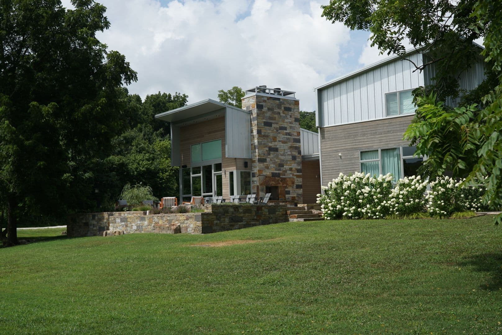 Project Sandstone Veneer Retaining Walls and Outdoor Fireplace in Bentonville image