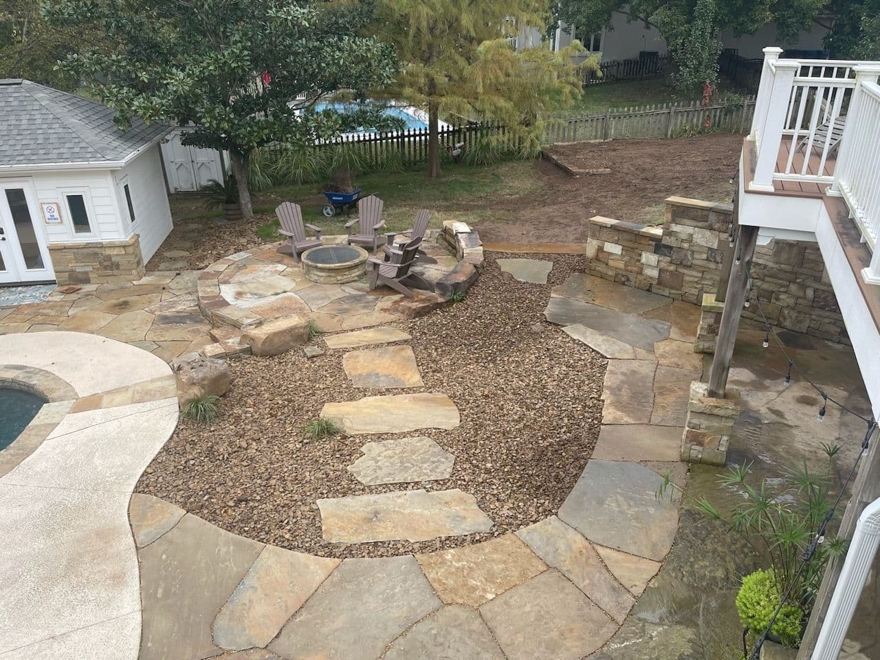 Stone Pathway to Fire Pit Oasis in Suburban Backyard