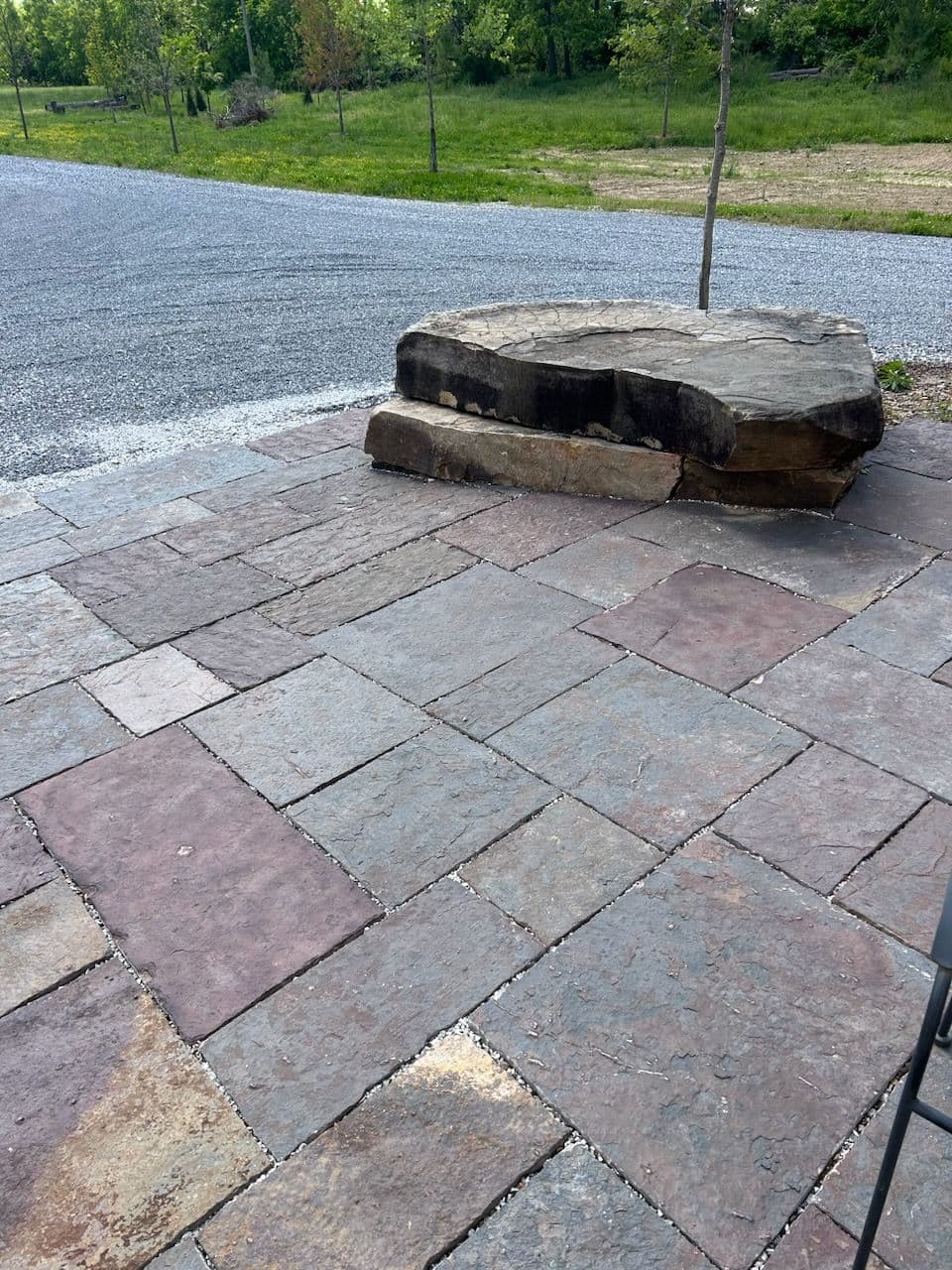 Stone Tile Patio Creates a Backyard Oasis in Rogers