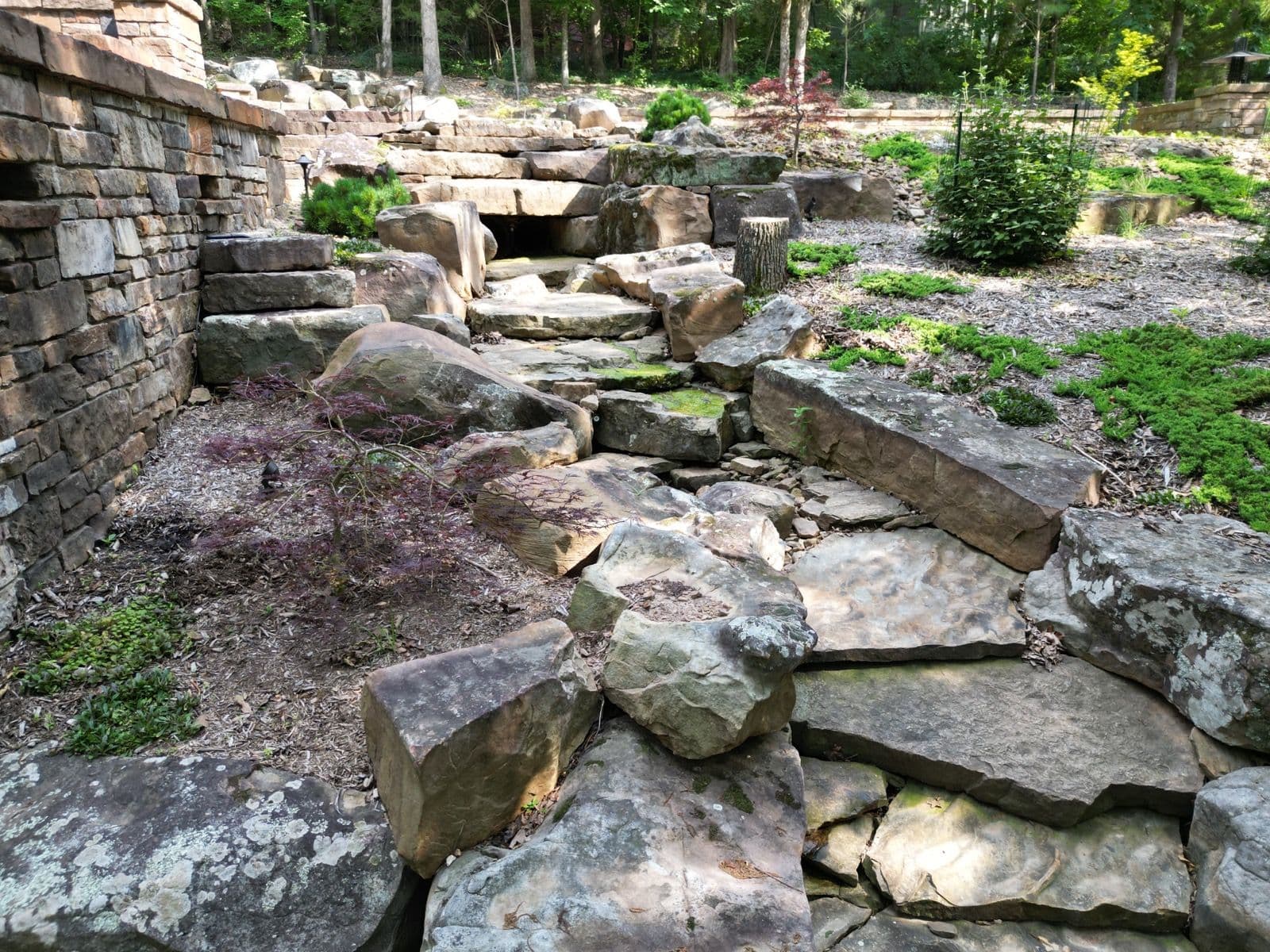 Project Transformative Landscaping with Mossy Boulders in Fayetteville image