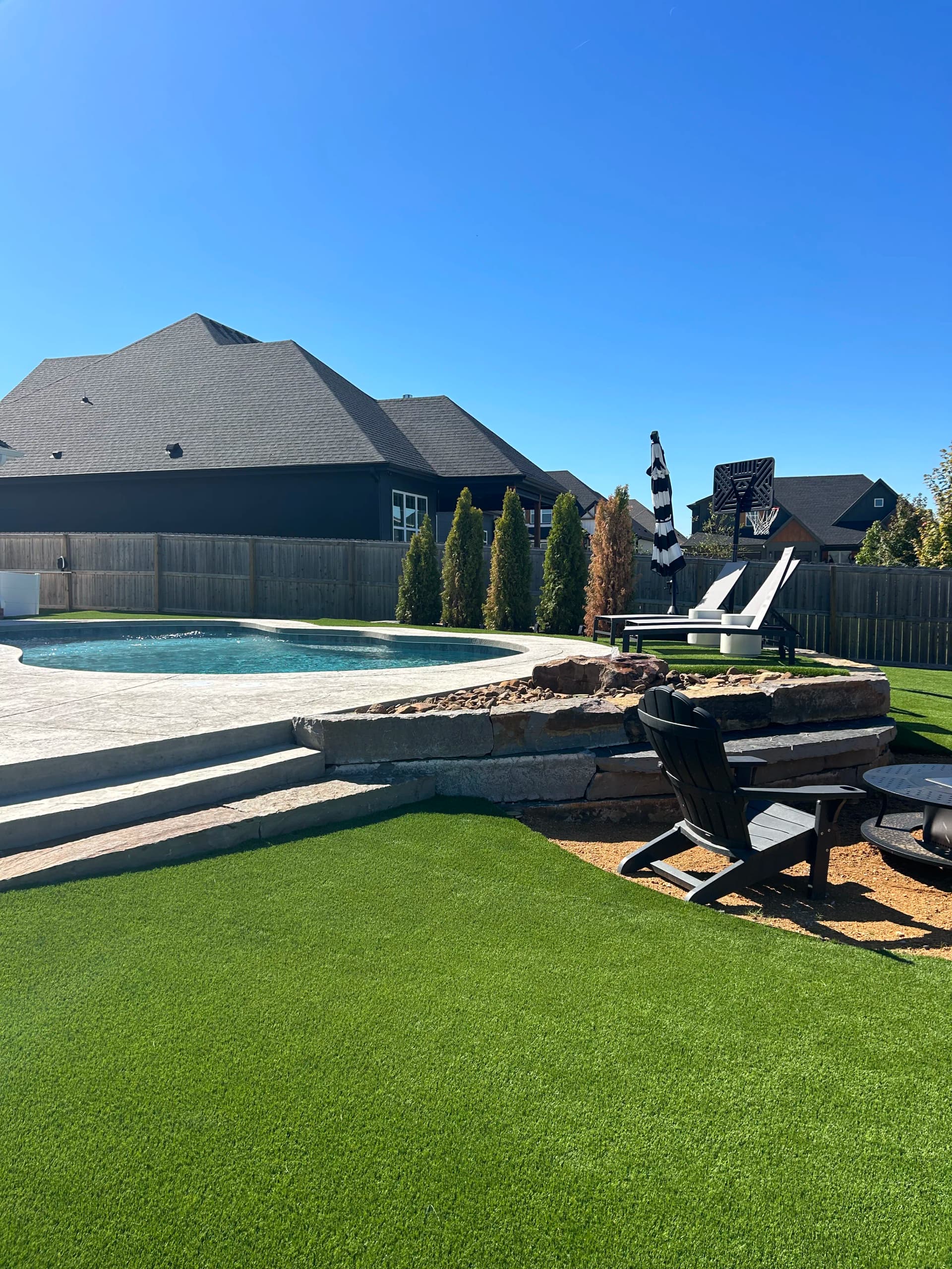 Gallery photos for Backyard Hardscape Build with Seating Wall and Water Feature in Bentonville: Image #1